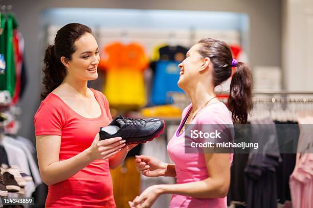 Shop Assistant Helping Customer Stock Photo - Download Image Now - Customer Focused, Smiling, Store