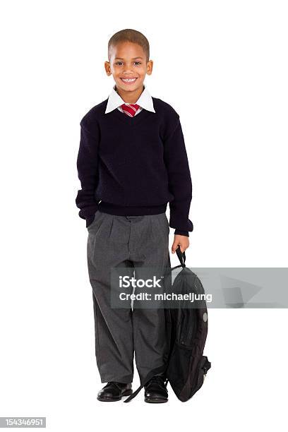 Photo libre de droit de Portrait De Mâle Élève Élémentaire Sur Blanc banque d'images et plus d'images libres de droit de Uniforme scolaire - Uniforme scolaire, Petits garçons, Enfant