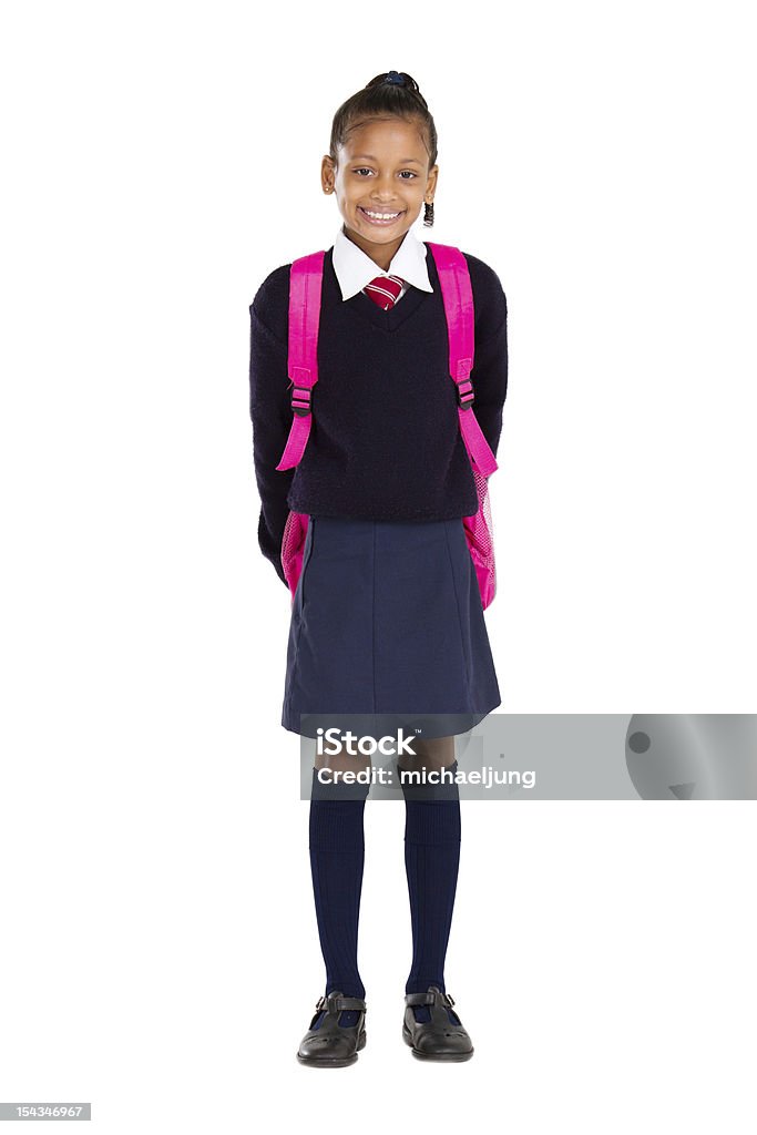 portrait of female elementary pupil full length studio portrait of female elementary pupil African Ethnicity Stock Photo