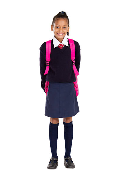 portrait of female elementary pupil full length studio portrait of female elementary pupil schoolgirl stock pictures, royalty-free photos & images