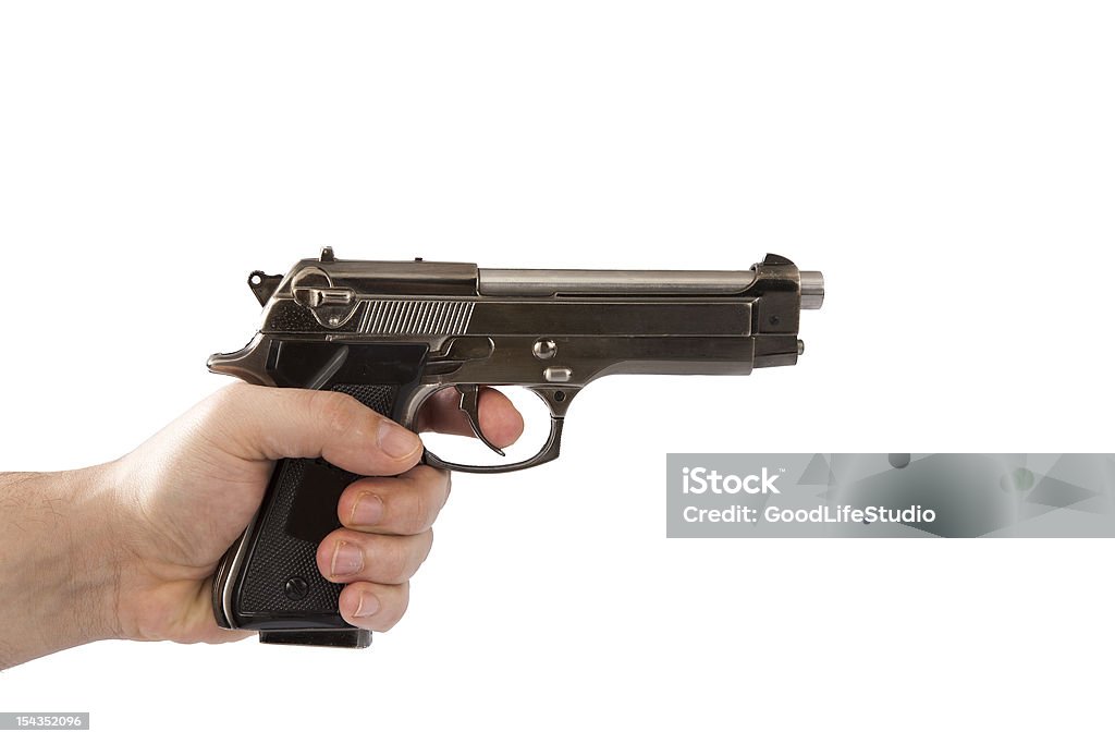 Homem segurando uma pistola - Foto de stock de Adulto royalty-free