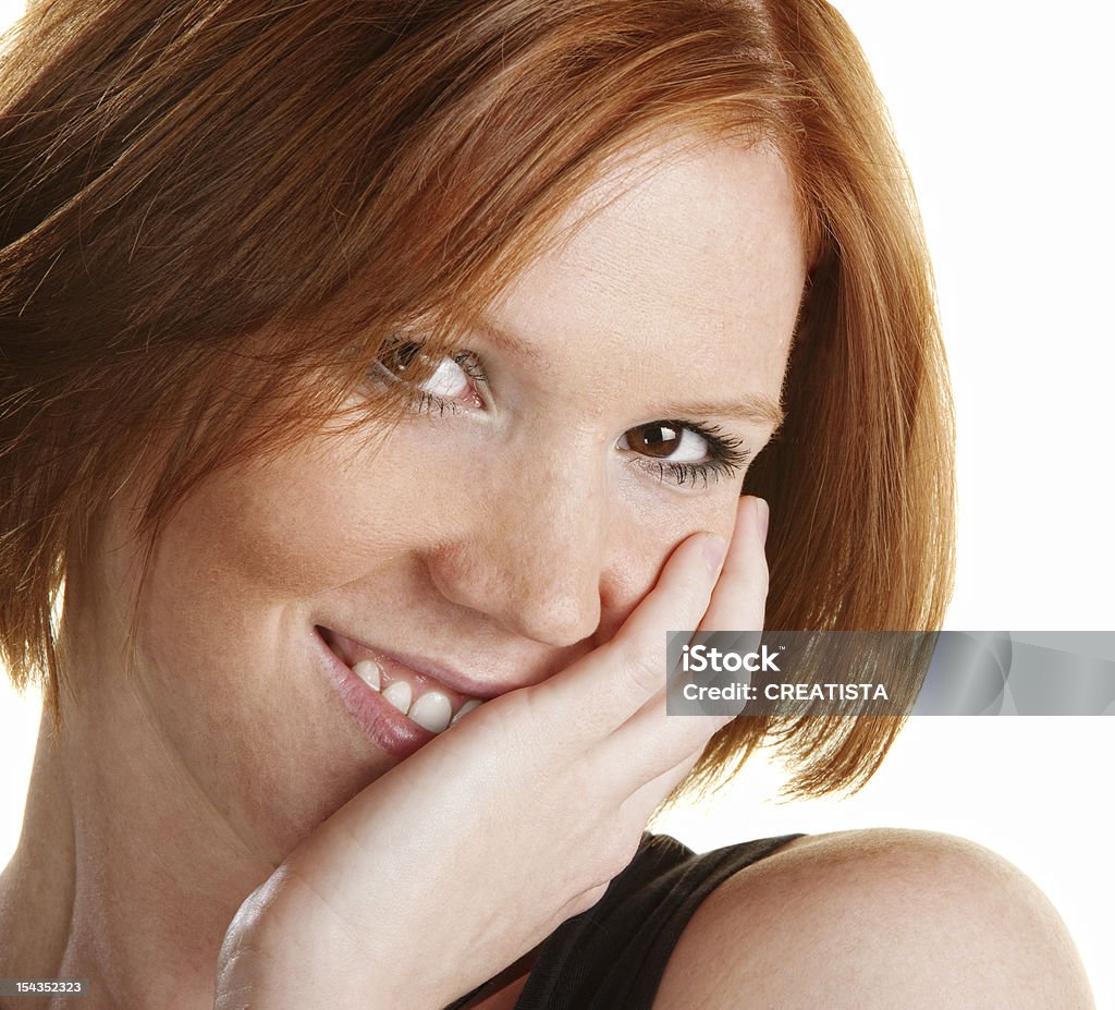 Smiling Caucasian Female Smiling young white woman with hand on cheek Adult Stock Photo