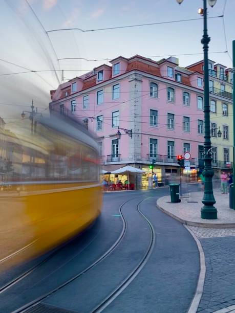 istock Lisbon Yellow Trams going into Old Town 1543533235
