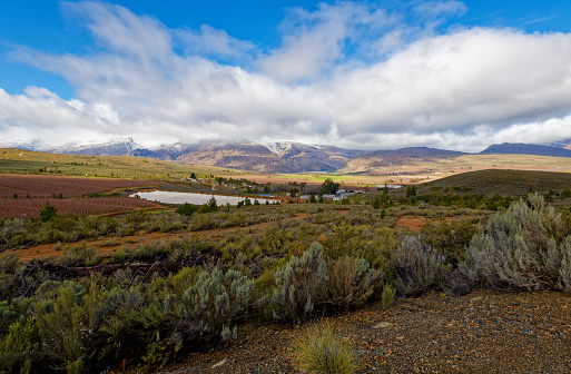 A panoramic view over a winter landscape with blue skies near Ceres, Western Cape, South Africa.
