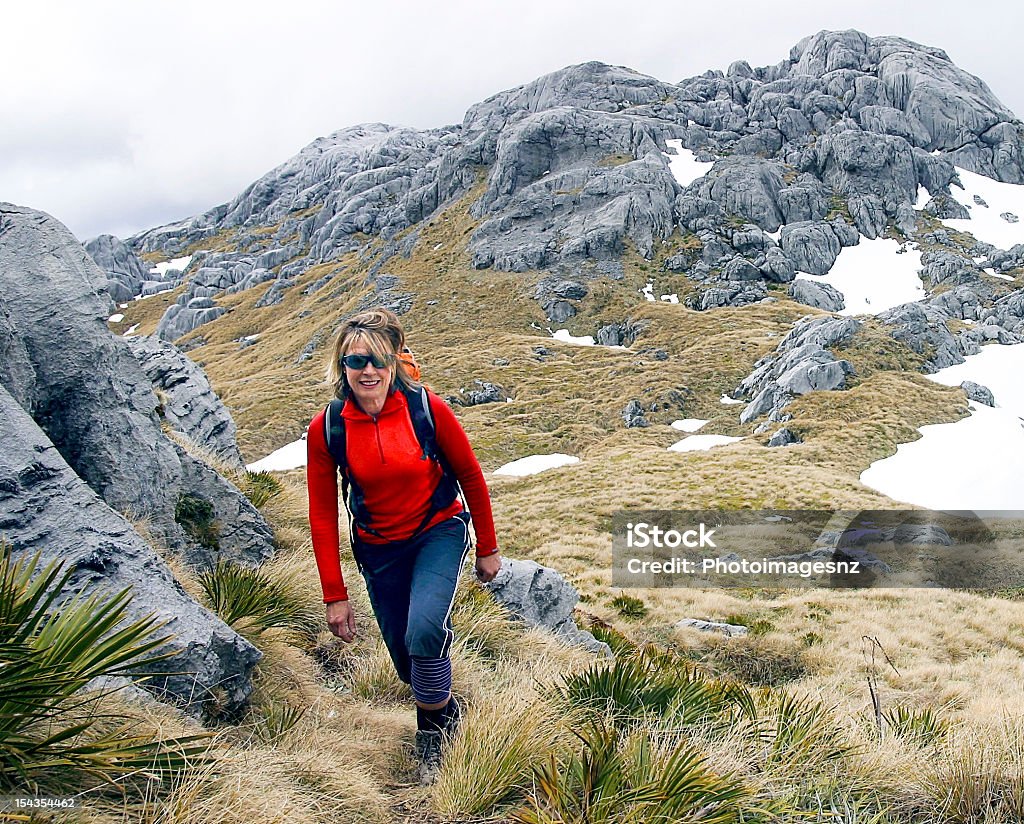 woman walking in Mountains, New Zealand Adult Stock Photo