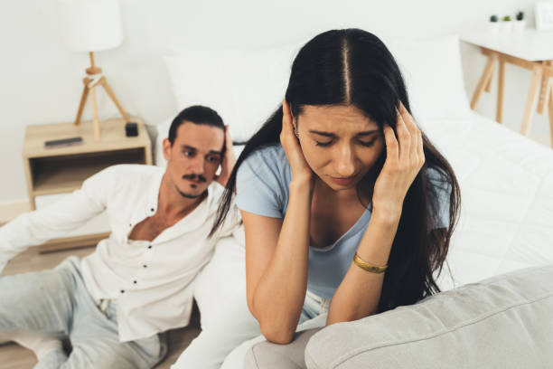 istock Upset and unhappy couple with problems, Young couple having quarrel at home, Relationship with problems, Conflicts in marriage 1543545299