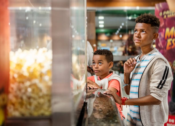 istock Two boys at concession stand for buying popcorn in cinema 1543574024