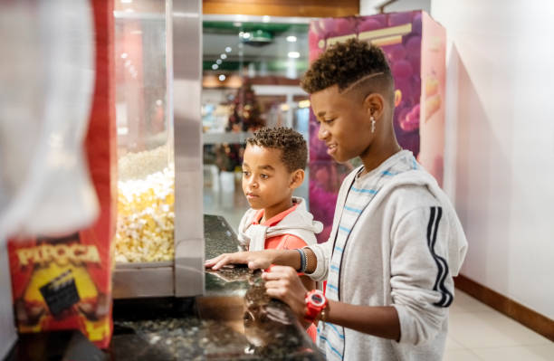 istock Two kids buying snacks at concession stand in cinema 1543574546