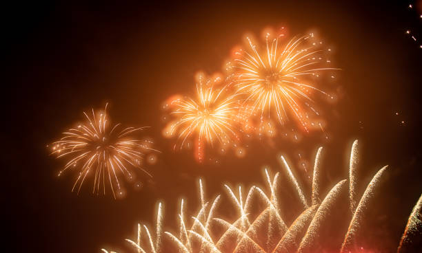 istock Brightly Colorful Fireworks Light Up the Sky. Beautiful New Year Fireworks. Dark Sky. Explosion. Abstract Colored Firework Background 1543635626