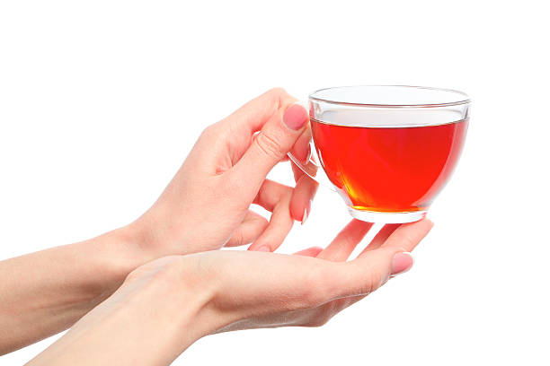 holding a cup of warm tea in hands