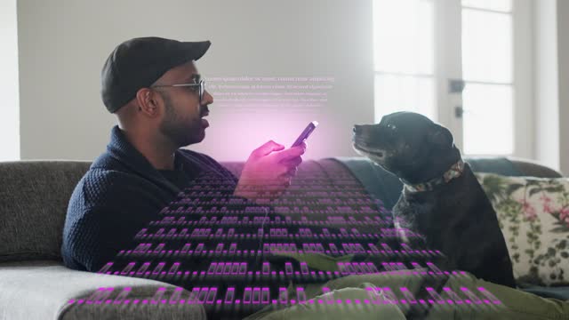 Phone decoding data while man waits with his dog