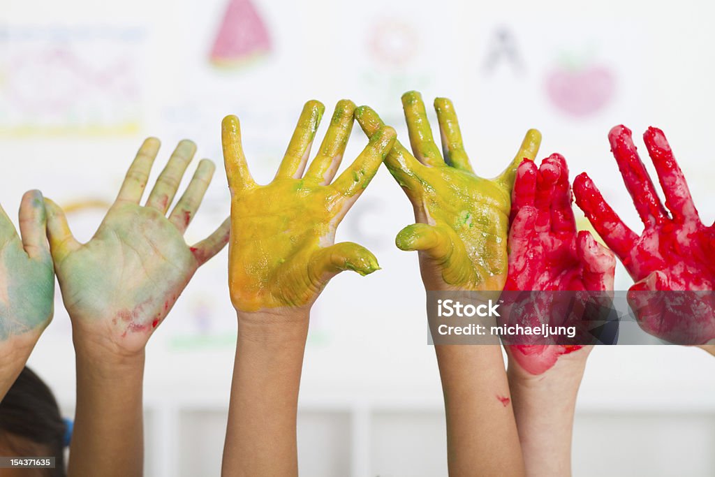 kids hands paint kids hands covered with paint in classroom Painting - Activity Stock Photo