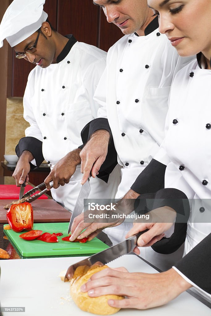 Grupo de chefs profissionais de culinária - Foto de stock de Hotel royalty-free