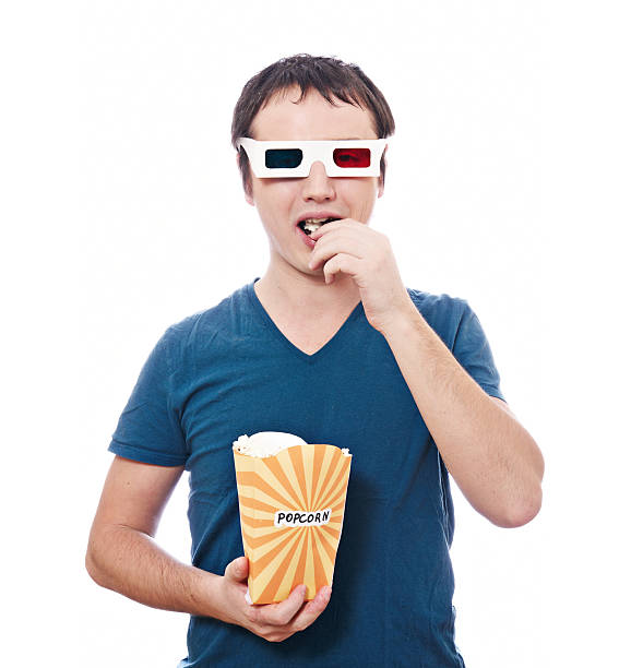 istock Young man in stereo glasses with popcorn 154376396