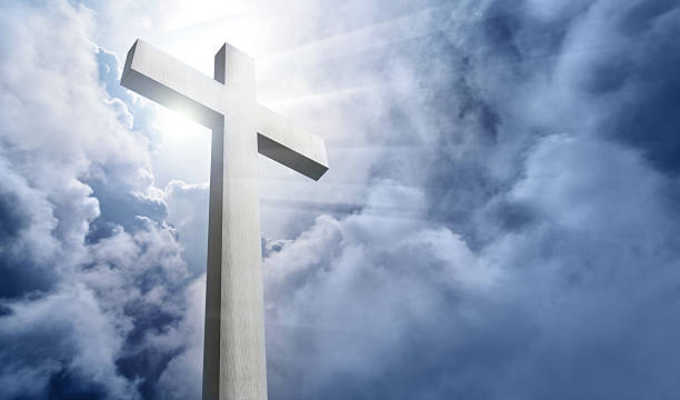 istock white wood cross and cloudy sky 154378111