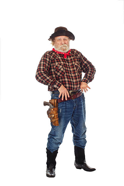 istock Old West cowboy stands with thumbs in belt 154378483