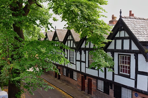 Old medieval residential houses by the city wall in the city of Chester in Uk