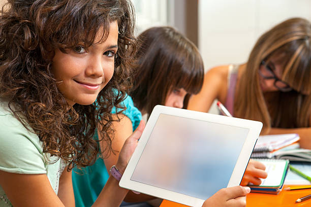 istock Cute girl holding tablet with copy space. 154378628