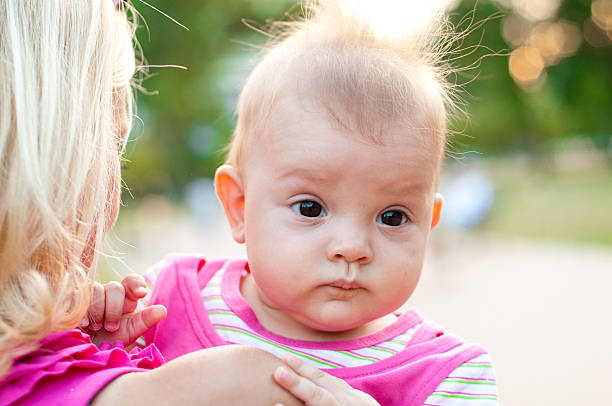 istock baby on mother's shoulder 154379230