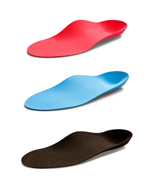Photo of Compilation of red, blue and black insoles 