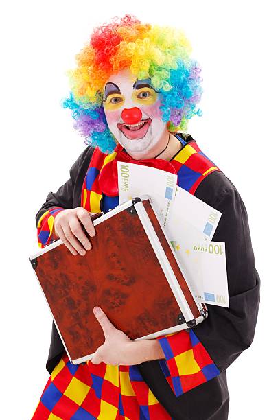 istock Clown holding briefcase with money 154380903