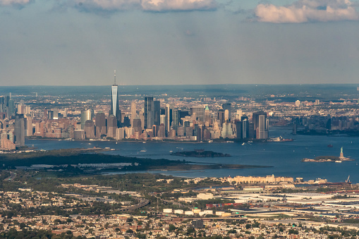 Aerial view of New York Harbor featuring the statue of liberty, Liberty Island, Ellis Island and Bayonne, NJ