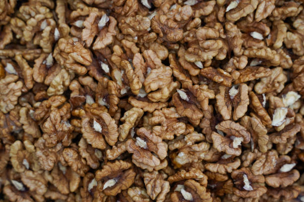 istock Peeled walnuts. Peeled walnuts background texture. Walnut wallpaper. 1543862019