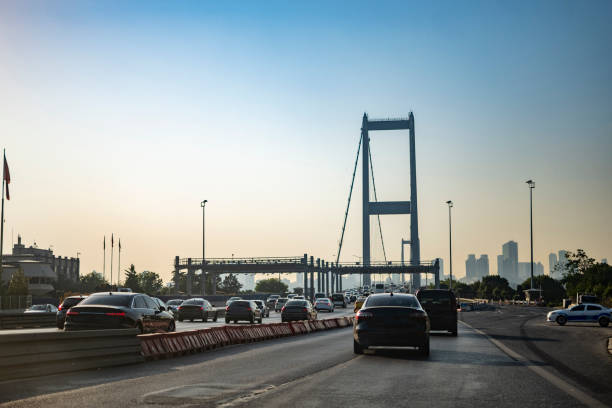 istock Cars on bridge to sunny day 1543868334