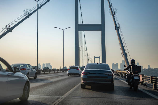 Cars on bridge to sunny day stock photo