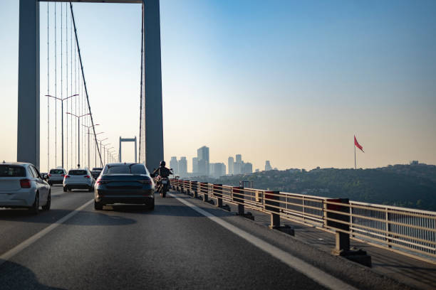 istock Cars on bridge to sunny day 1543898672