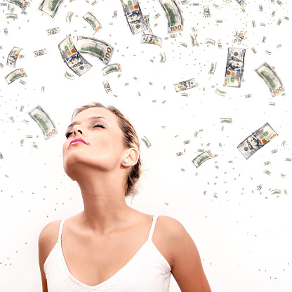 Making money and prosperity concept of woman and falling large group of money