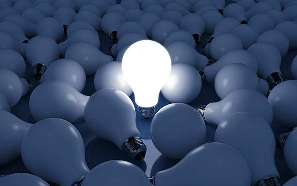 istock A close-up of a bunch of light bulbs with one lit 154393027