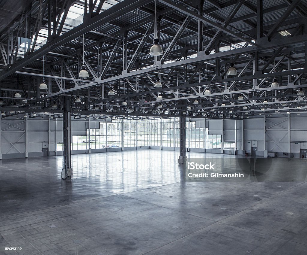 Interior of an empty warehouse Interior of an empty warehouse with glass wall Empty Stock Photo