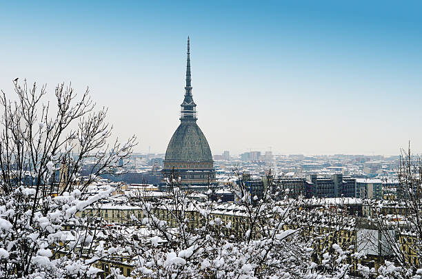 Winter cityscape of Torino Turin, Italy, in winter. Snow covered roofs and Mole Antonelliana turin stock pictures, royalty-free photos & images