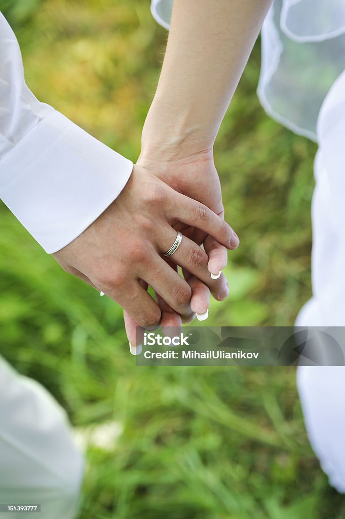 bride and groom to hold hands. Family love bride and groom to hold hands. Family harmony Adult Stock Photo