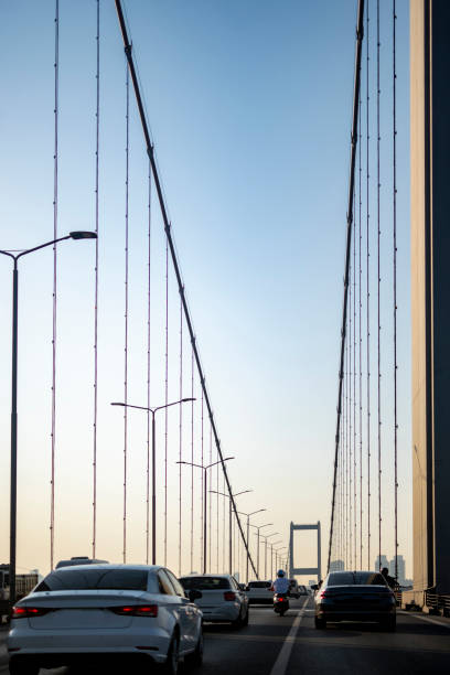 istock Cars on bridge to sunny day 1543942962