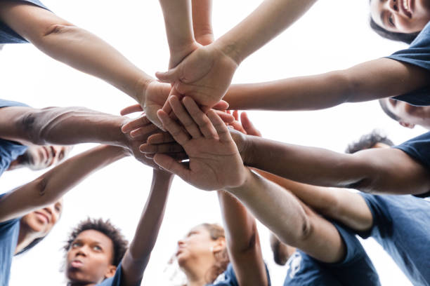 istock Low angle image of unrecognizable people putting their hands in together 1543945612