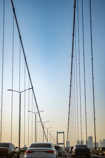 istock Cars on bridge to sunny day 1543949749