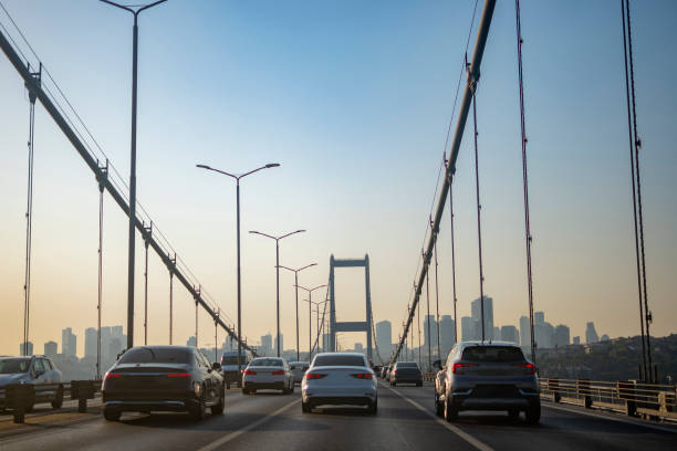 istock Cars on bridge to sunny day 1543955950