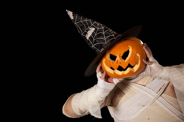 istock Scary Halloween Mummy- Pumpkin Man with witch hat 154396356