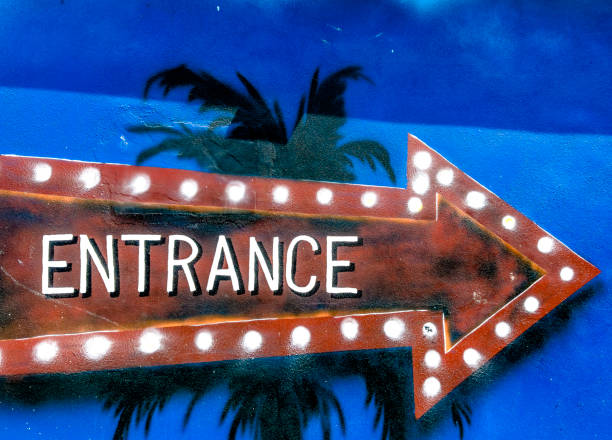Close up entrance sign painted on building wall in Downtown Sarasota, Florida