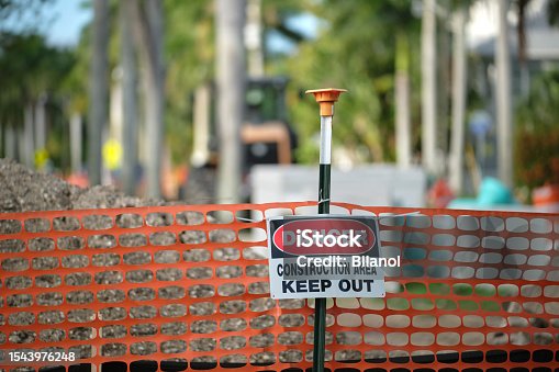 istock Protective barrier at construction site for safety restriction 1543976248