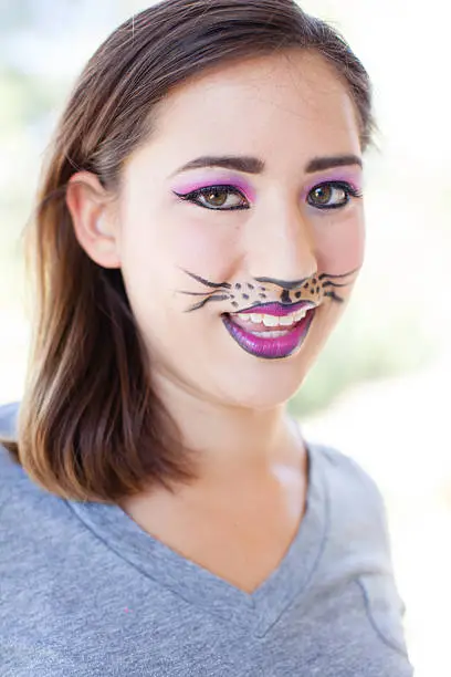 Pretty Brunette woman in cat makeup