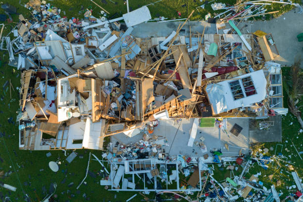 istock Property damage from strong hurricane winds. Mobile homes in Florida residential area with destroyed rooftops. Consequences of natural disaster 1543977310