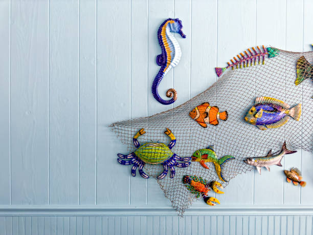 Ceramic tropical fish decoration on wall Fish decoration on tropical island building exterior in Florida small florida home stock pictures, royalty-free photos & images