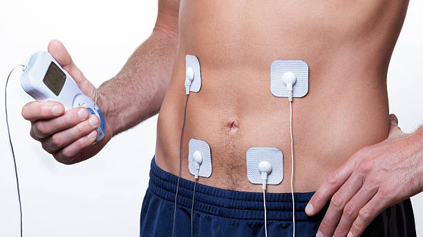 Ems Training Electrical Muscle Stimulation Stock Photo - Download Image Now  - Muscular Build, Electricity, Electrode - iStock