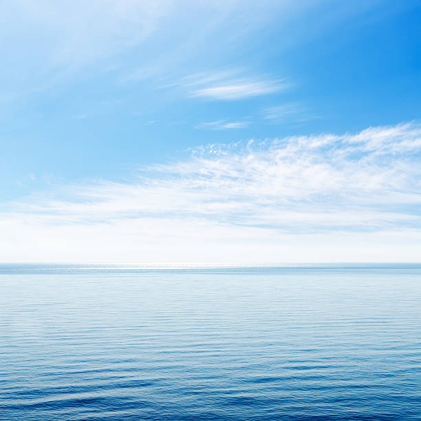 istock blue sea and cloudy sky over it 154411529