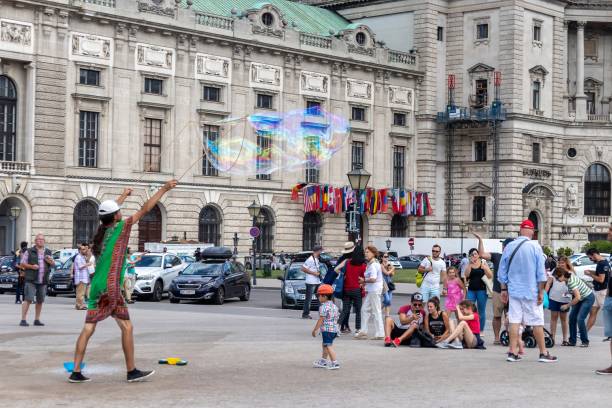 A street performer making giant soap bubbles stock photo