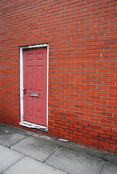 istock Urban red door gunshot with wall copy space 154416091