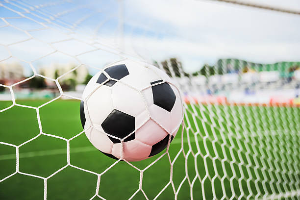 istock football in the goal net 154419055